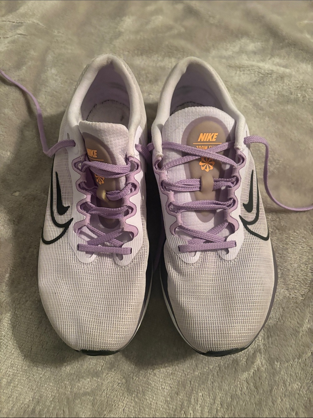 Nike Women's Light Lavender Athletic Running Shoes with Black Swoosh